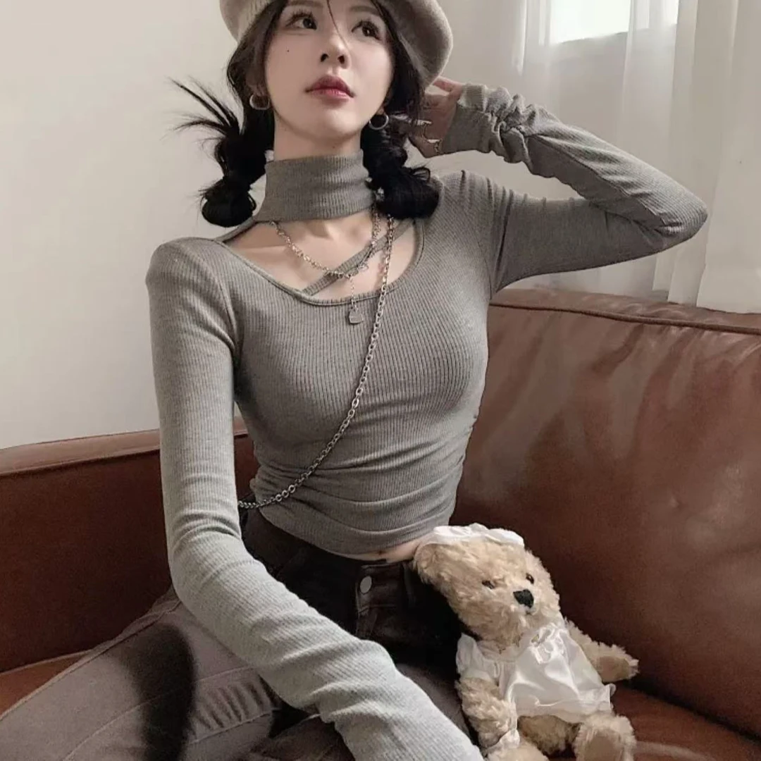 别致设计感小众针织衫女春季纯欲甜辣风短款高领镂空内搭打底上衣