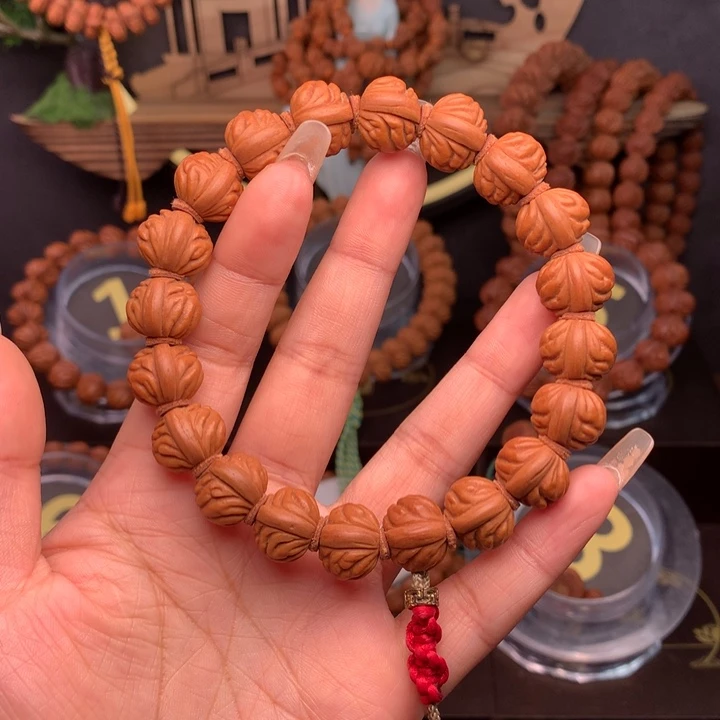 桃核吊坠张*蟀1.4野生红莲手串