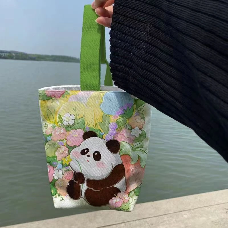 胖胖卡通熊猫panda花花果赖手提遛弯水桶收纳小布袋原创手腕包