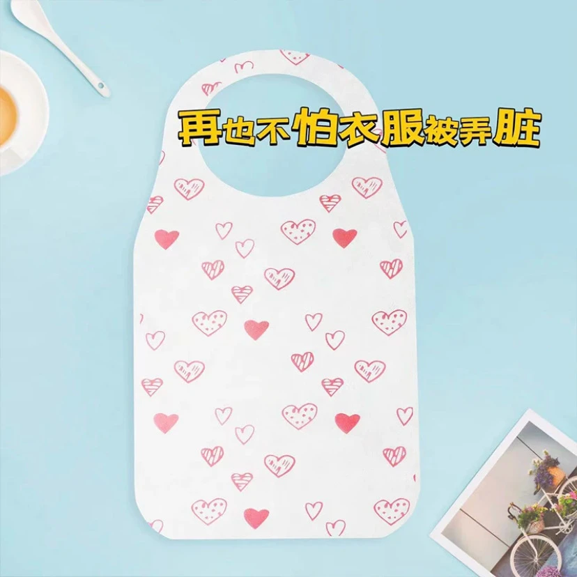 【新疆也包邮】新款爱心一次性无纺布围裙透气印花用餐烧烤餐饮围裙