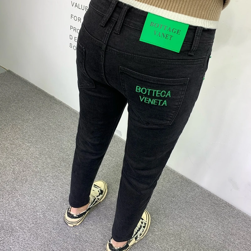 秋季高档纯黑色牛仔裤男潮流字母刺绣弹力修身百搭时尚小脚九分裤