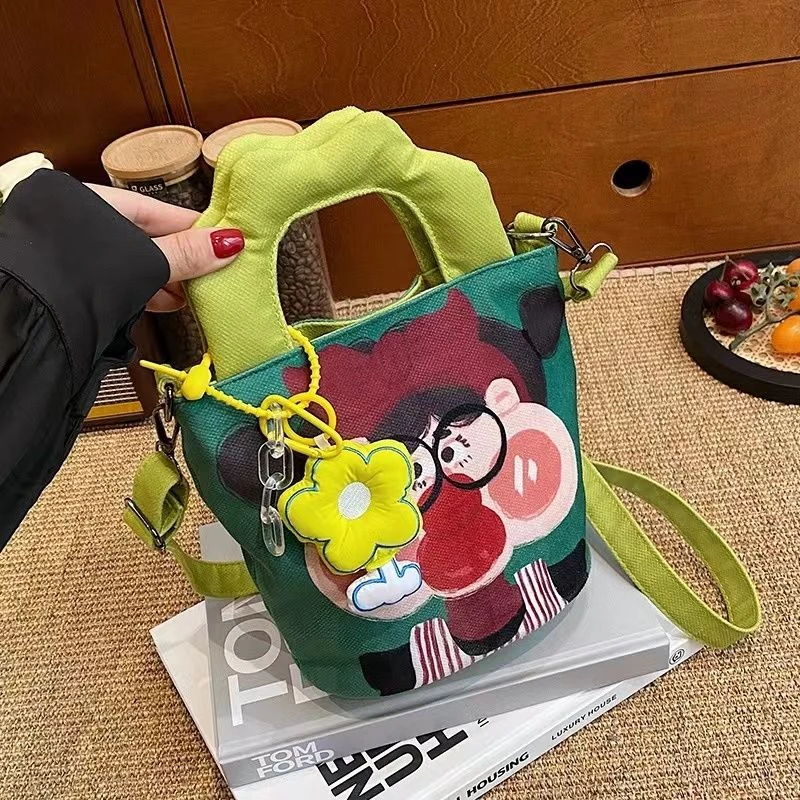 搞怪丑萌插画帆布包包女涂鸦手拎水桶包ins可爱卡通单肩包斜挎包