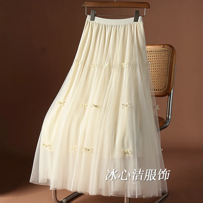 杏色蝴蝶结网纱大摆蓬蓬半身裙女春季2025新款中长款裙子伞裙纱裙