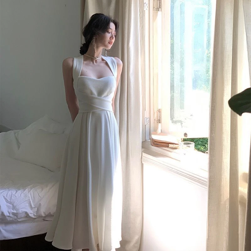 白色修身交叉绑带吊带连衣裙女2023显瘦新款气质温柔风挂脖a裙子
