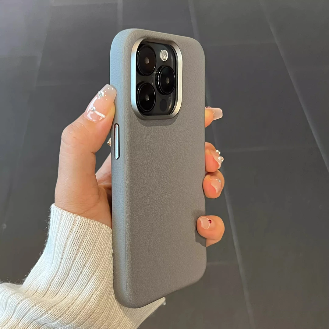 适用苹果16promax手机壳高档纯色真皮大孔金属镜头男女高级感商务