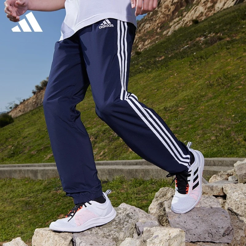 adidas阿迪达斯官方男款轻运动三条纹舒适速干束脚长裤 GK8983