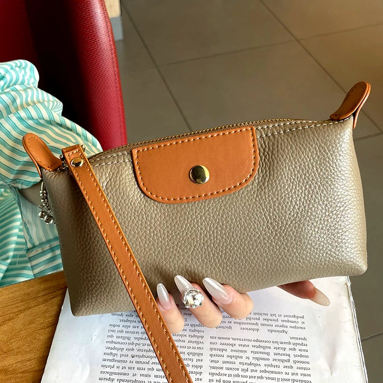 真皮手拿包女2025新款高端大容量时尚手抓包可放手机高级牛皮小包