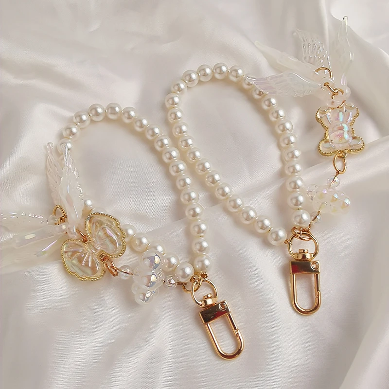 手机挂绳短款手腕串珠时尚珍珠挂链天使翅膀吊坠女生新款ins个性