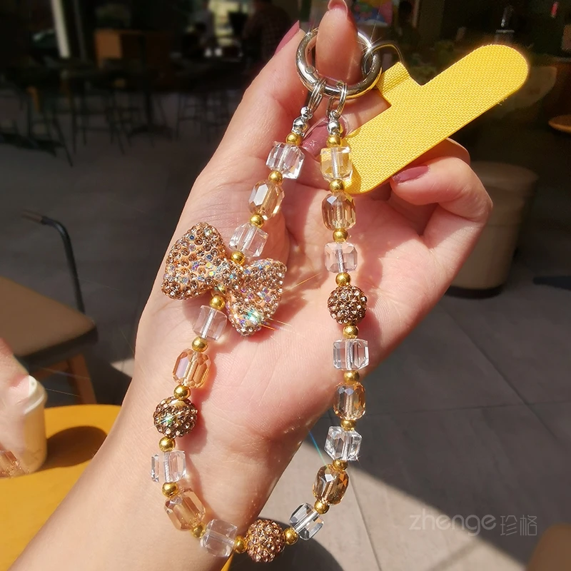 闪钻蝴蝶结水晶手机链女款手提手腕挂饰短款挂链夹片式手机壳挂绳