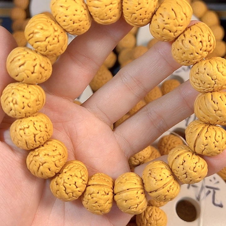 寒***瑟手串桃核树王纽扣桃核手串