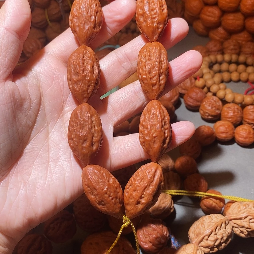 那***红吊坠文玩核桃19尺子弹头手串