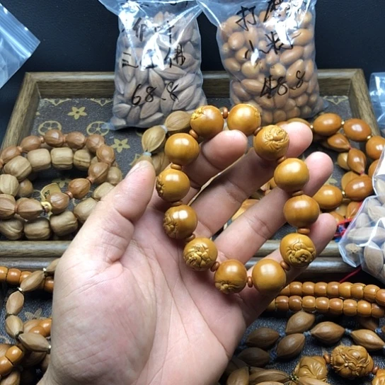 吊坠橄榄核来咯考虑
