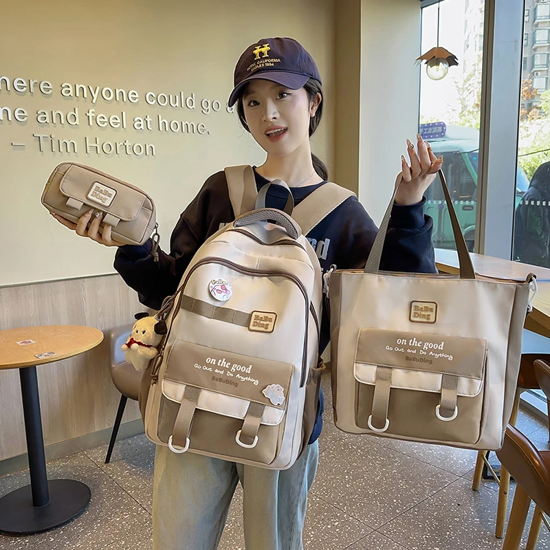 小学生书包女生初中生护脊减负百搭轻便大容量新款高中生双肩包