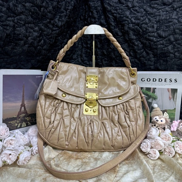 95新 MIU MIU/缪缪 黄色中号元宝斜挎包手提包