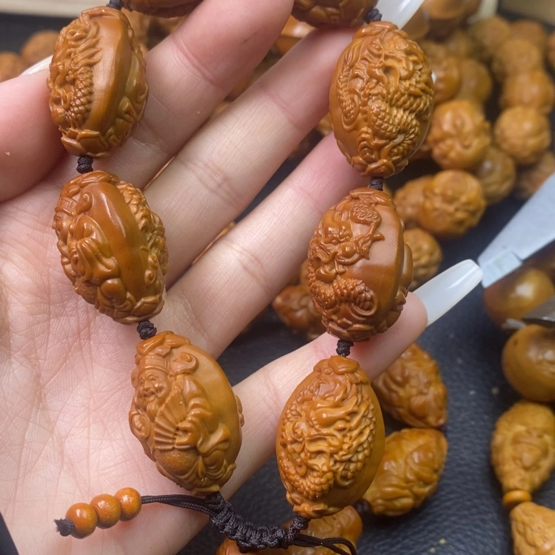 橄榄核吊坠睡**.橄榄核龙财神