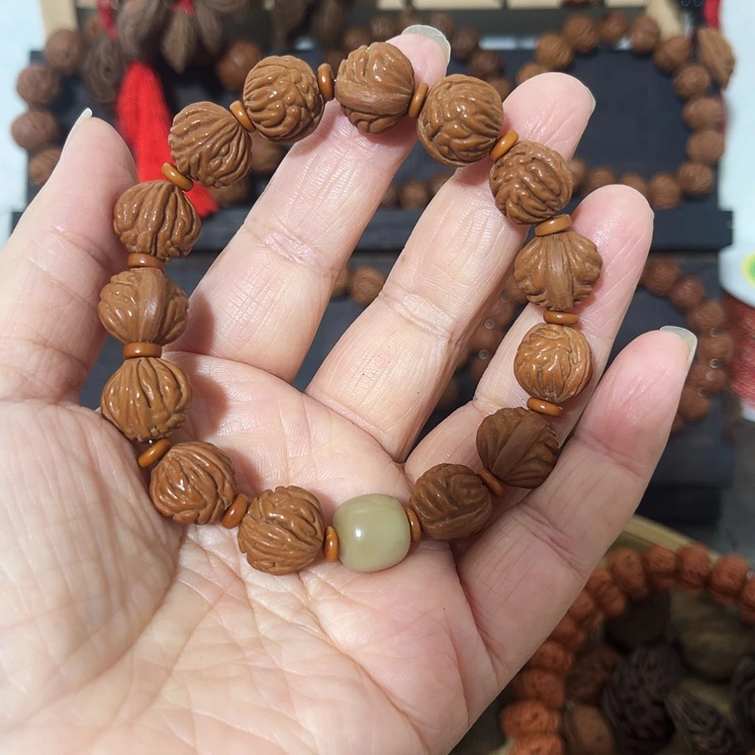 爱***舞野生桃枭小籽手串