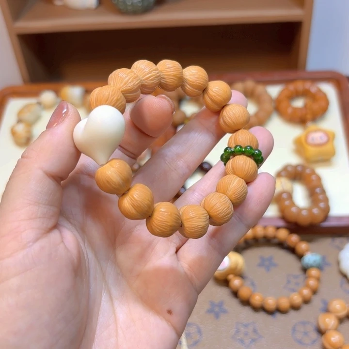 星月菩提手串猴头拉丝爱心手串象牙果爱心