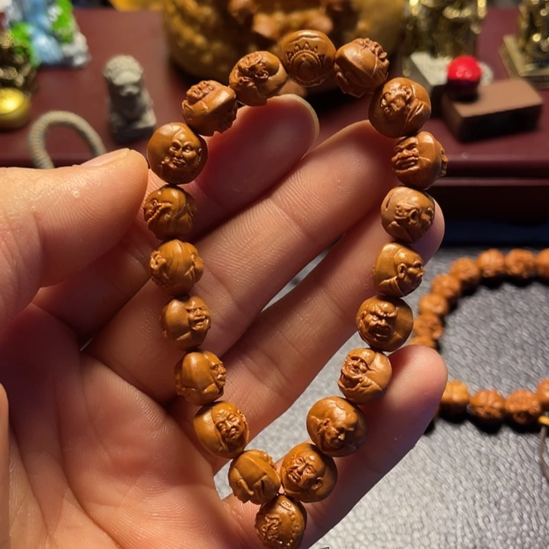 龙纹桃核雕刻双面罗汉