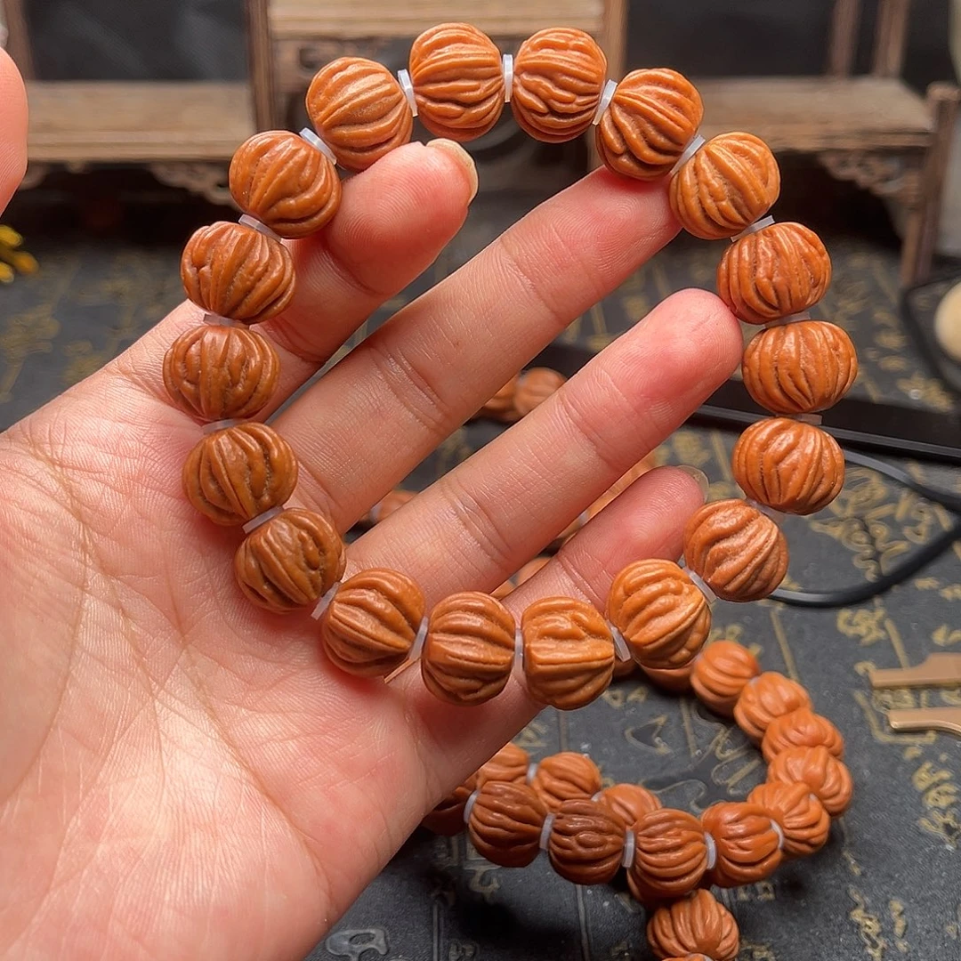 桃核吊坠佛手手串