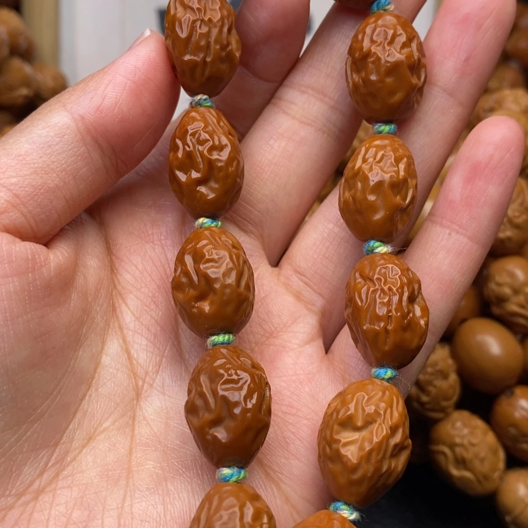 橄榄核吊坠红枣手串