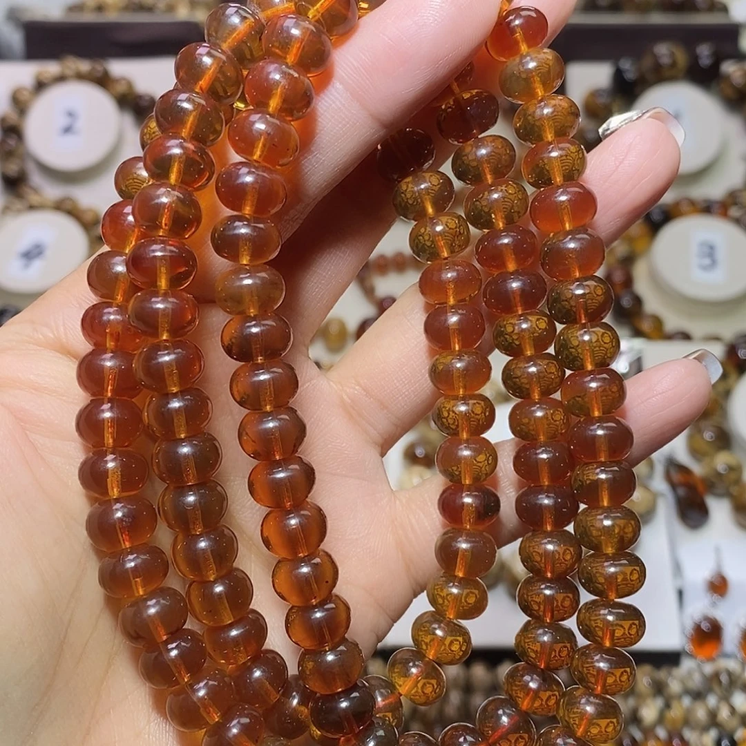 W***_琥珀未镶嵌裸石豆油红9mm