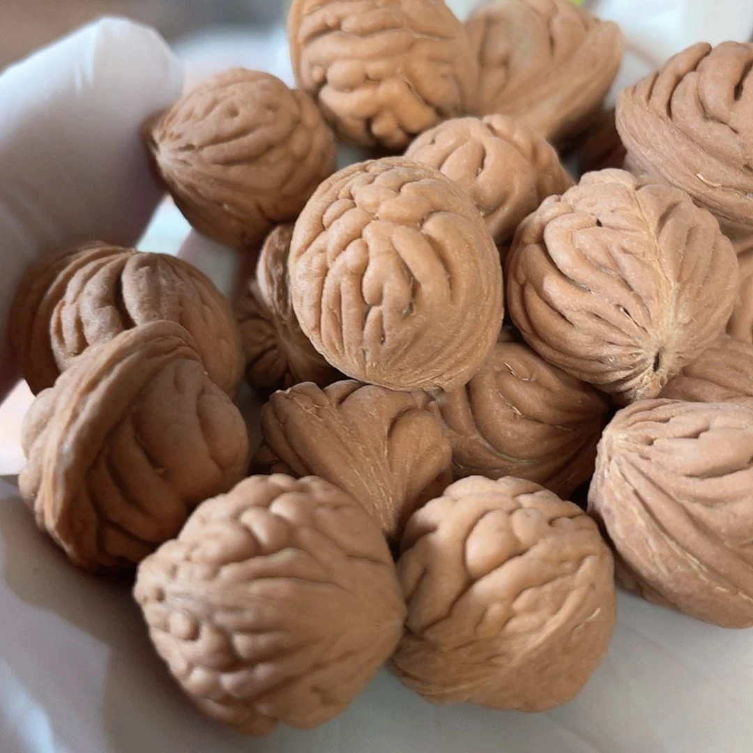 桃核把件疙瘩豹子头散核有瑕疵一斤16/17