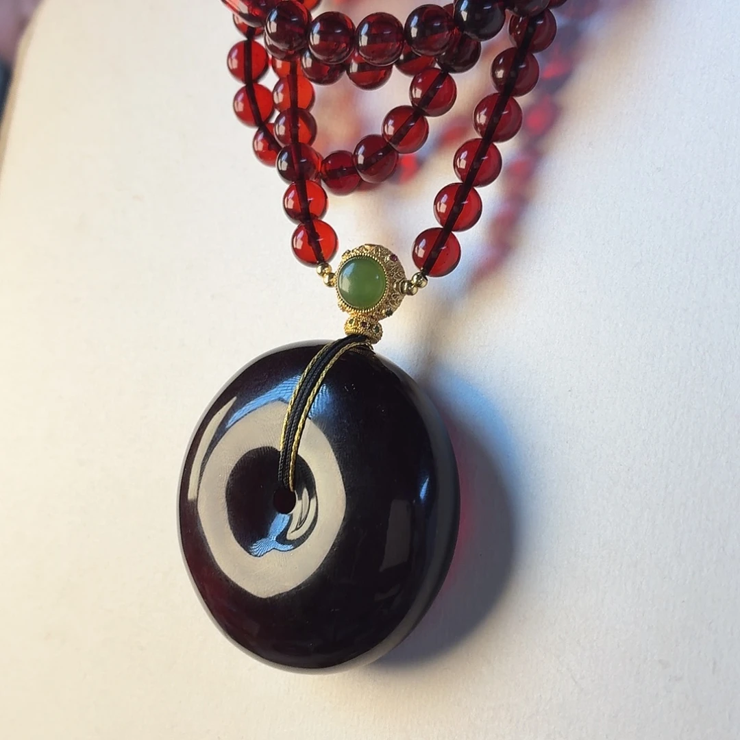 琥珀未镶嵌颈饰血珀平安扣