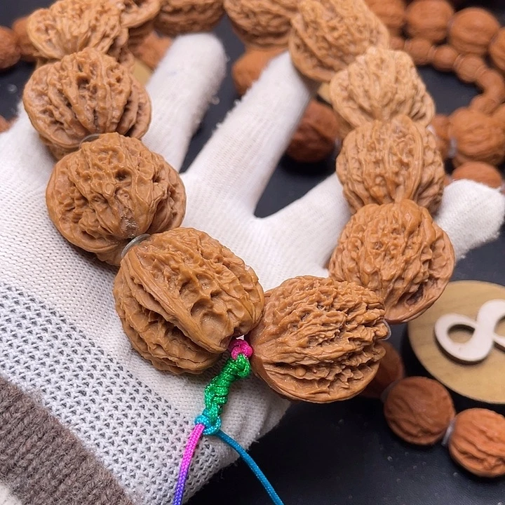 爱***。文玩核桃把件野生嘛核