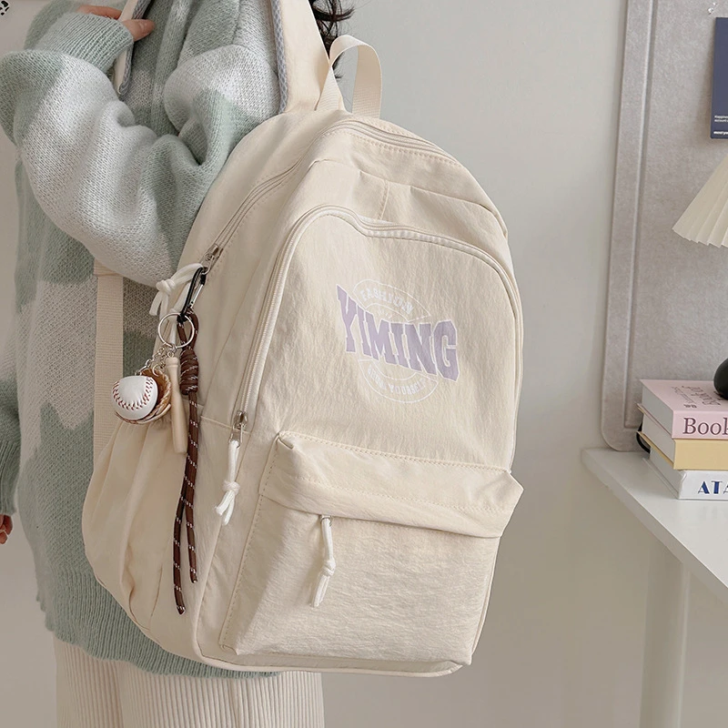 2025新款韩版双肩背书包初高中女时尚大容量轻便百搭简约纯双肩包