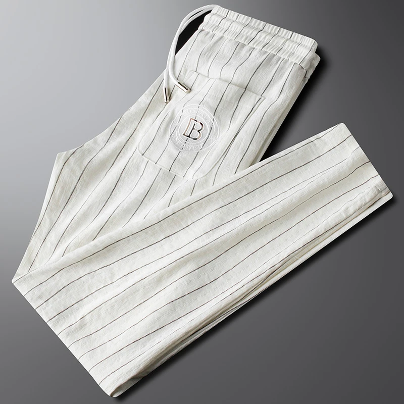 轻奢侈夏季薄款冰丝仿亚麻白色休闲裤男款修身潮牌刺绣直筒长裤男