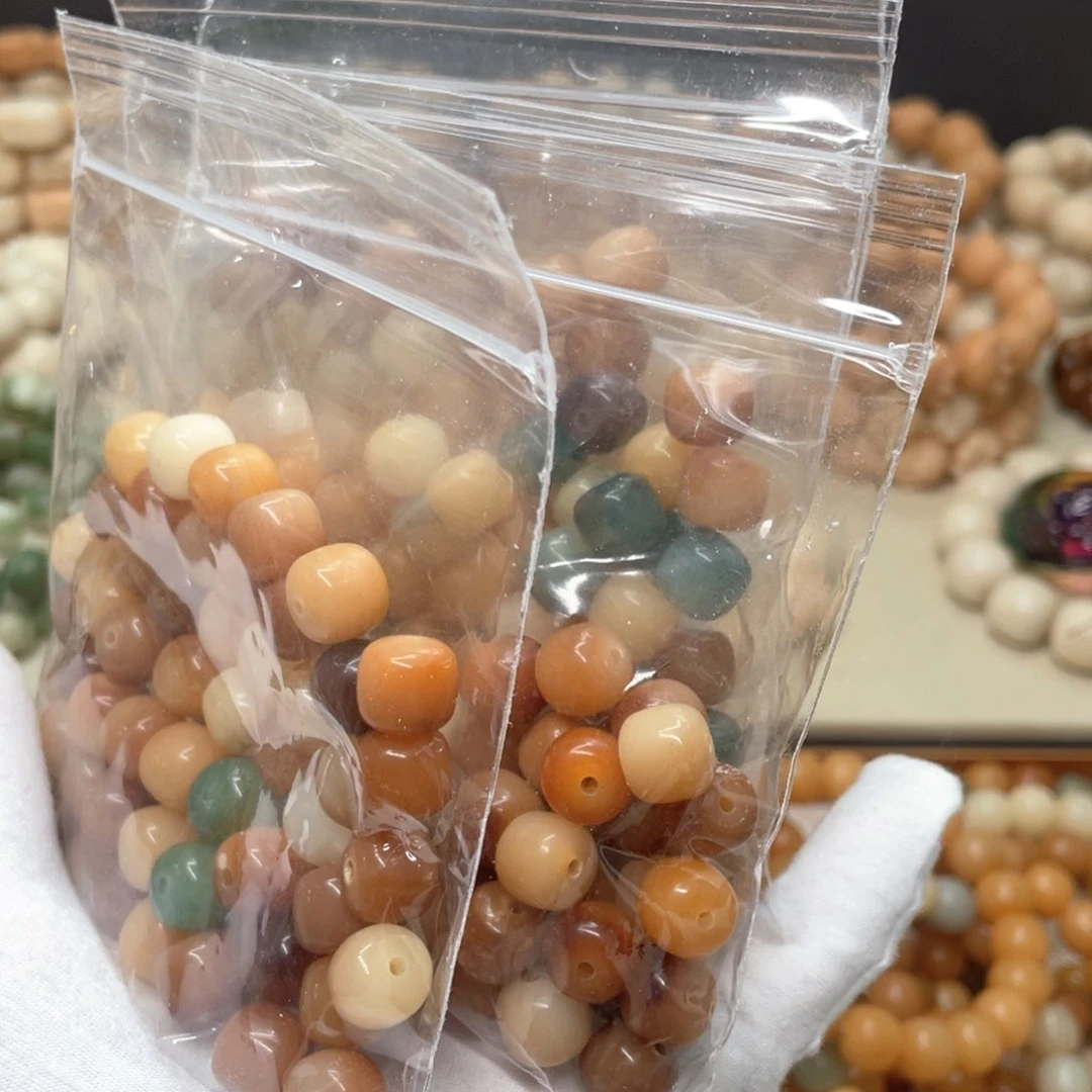 菩提根/象牙果吊坠瑕疵水磨11桶50颗0010