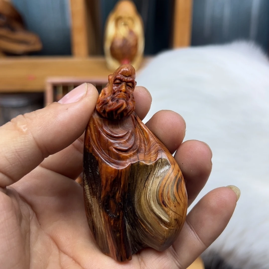 挥***←木崖柏木摆件手把件