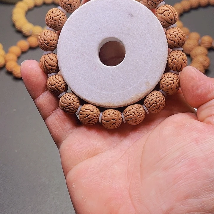 桃核吊坠望*桃李经理