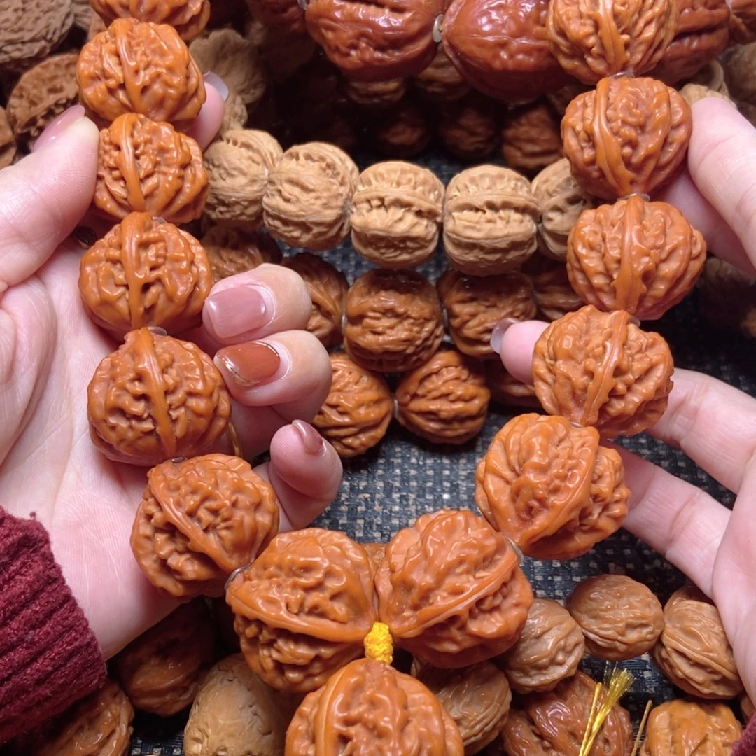 往***风桃核吊坠京八棱手持