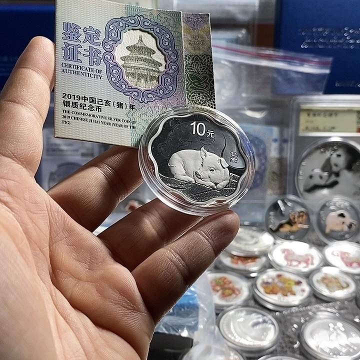 纯银罗*飞原盒证19年梅花猪银币一枚如图