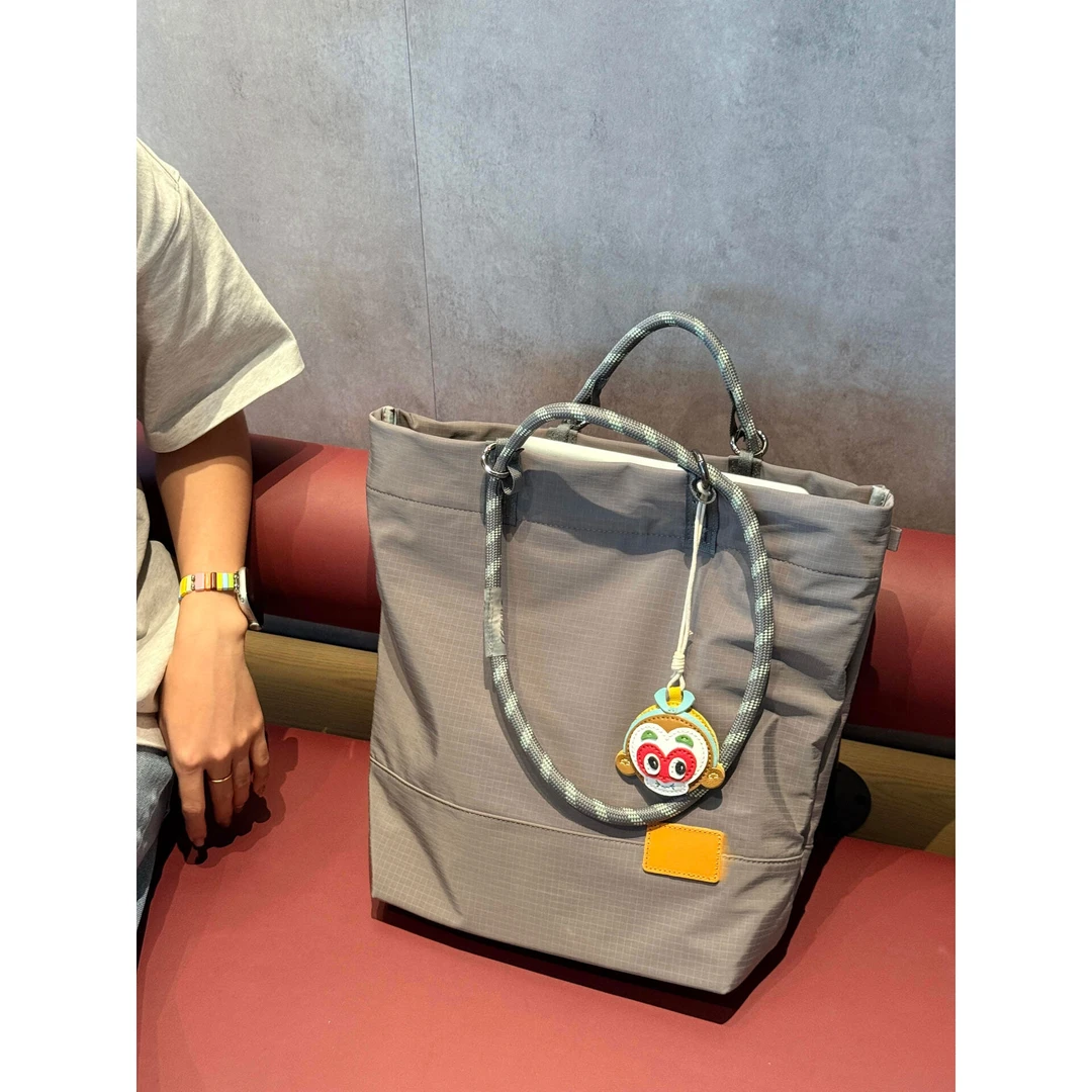 牛津尼龙帆布男女通用水桶包2025新款轻便单肩托特腋下手提电脑包