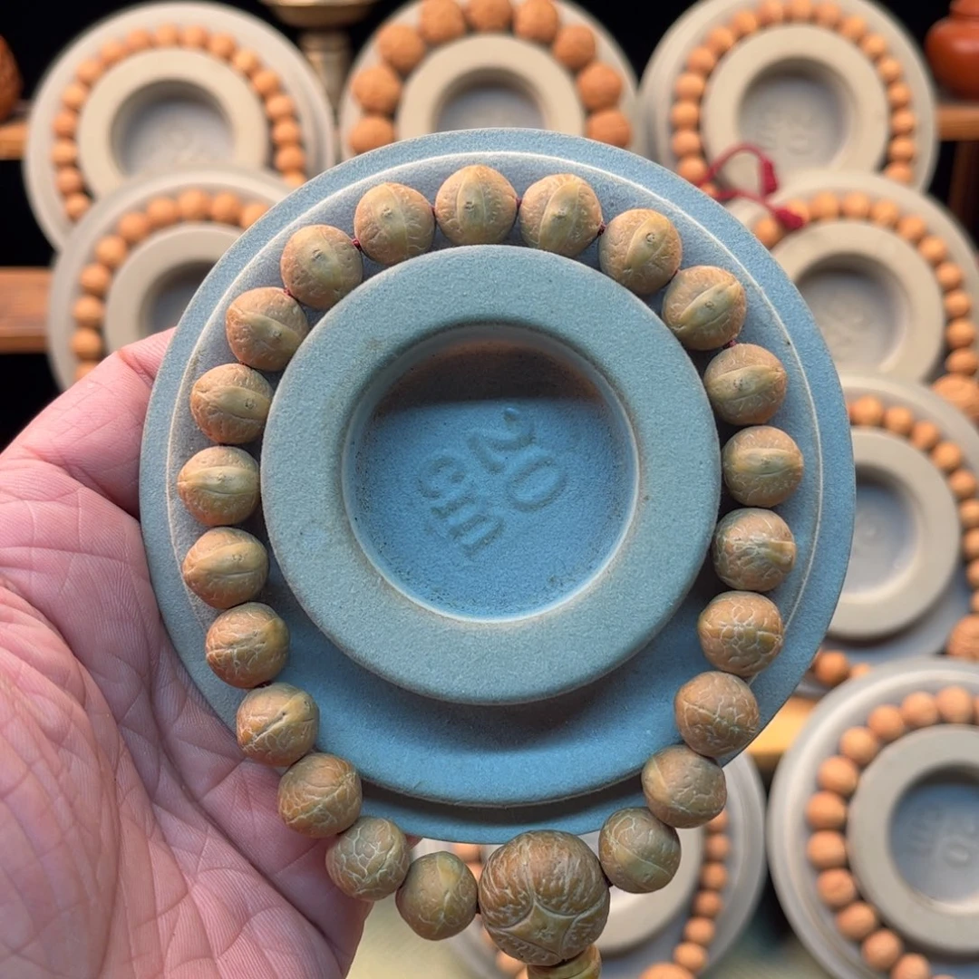 寧***學凤眼菩提吊坠12毫米粉红皮玉化皮实心籽同树籽矮桩