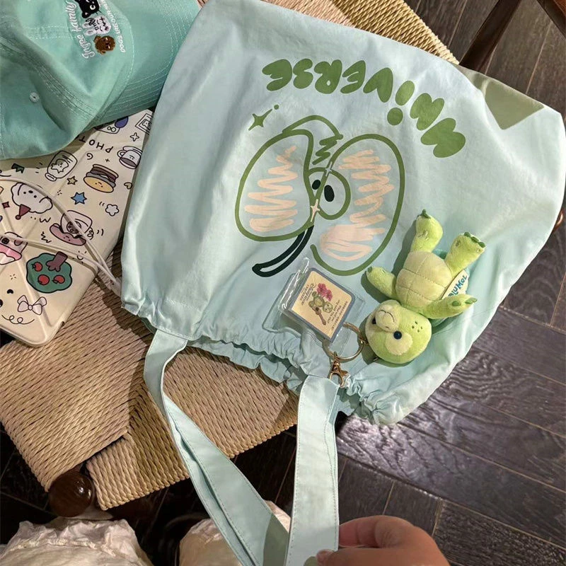 2025新款大容量小清新青苹果抽带防脏卡位单肩包少女学生通勤风包