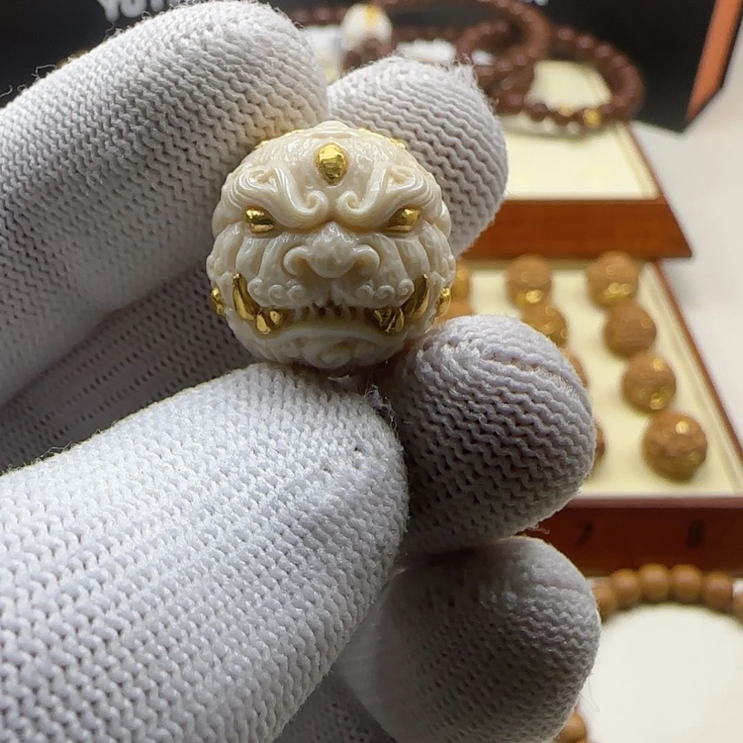 猴头核桃吊坠遼****對双面唐狮镶嵌24k