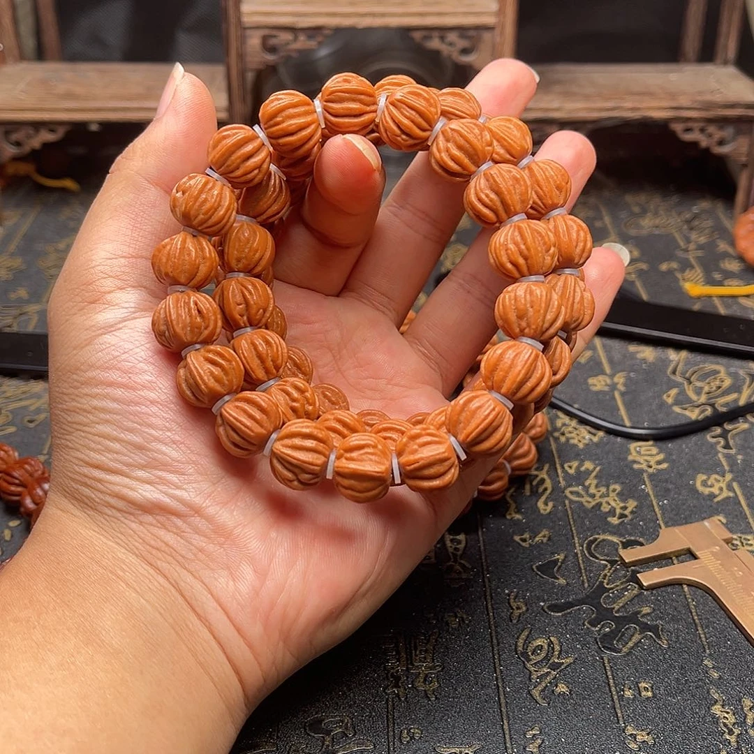 桃核吊坠佛手手串