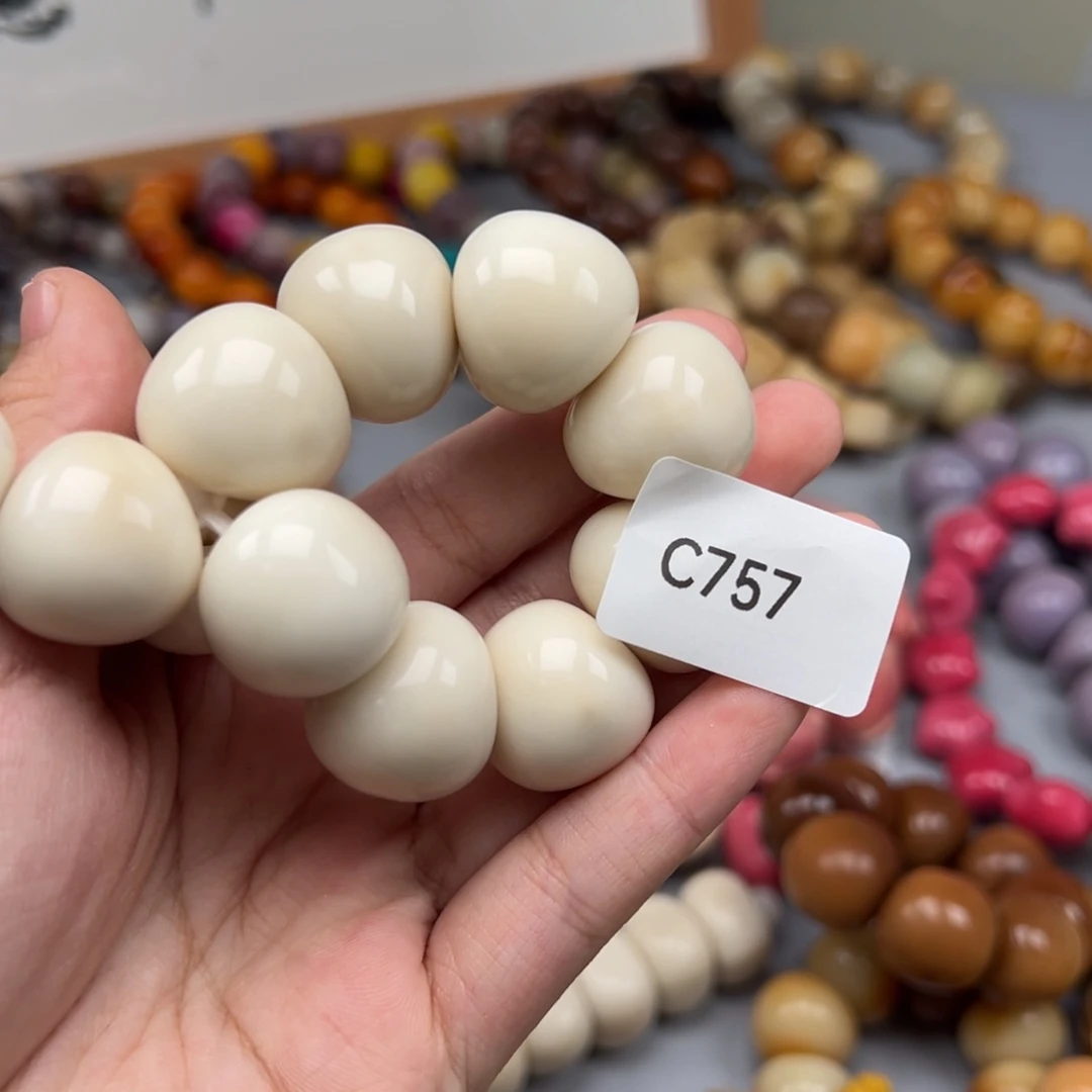 苏***米吊坠菩提根/象牙果C757蒜瓣21-25瑕疵一串