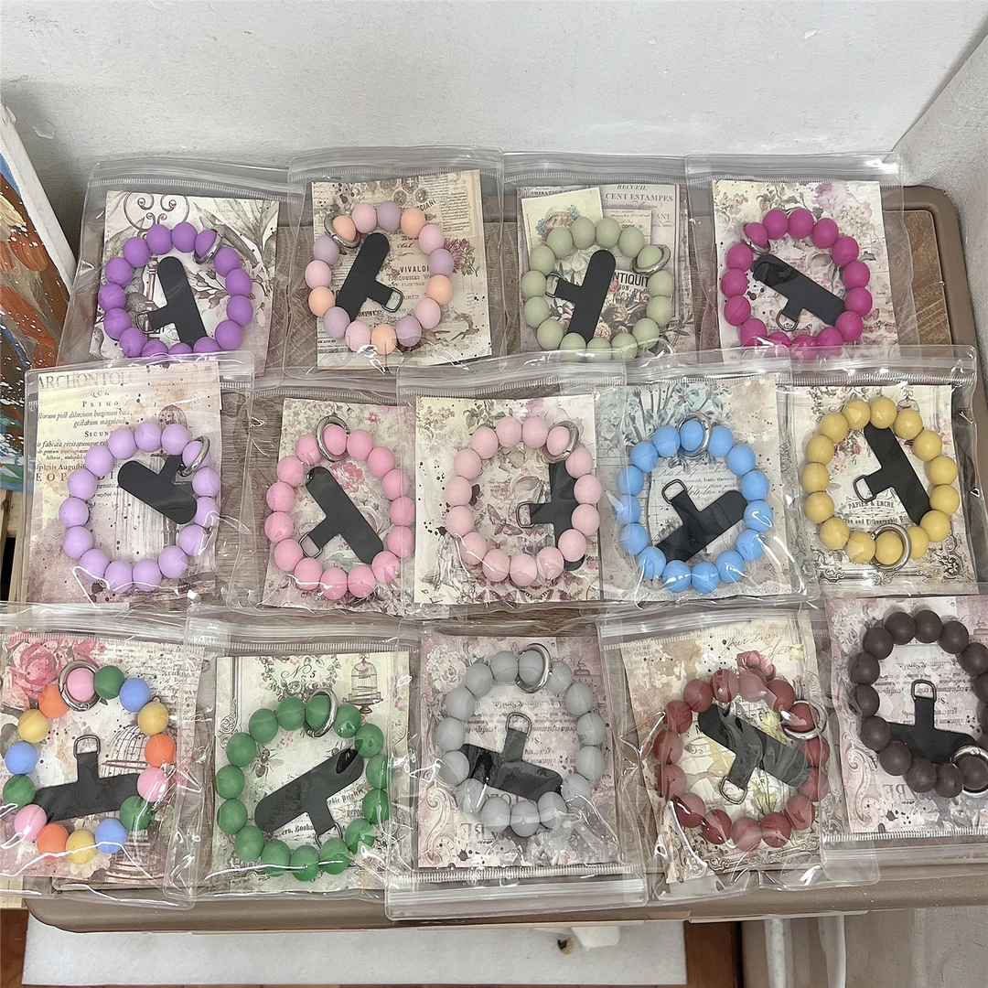 多巴胺彩色豆豆手拎圆环手腕紫绿粉弹力挂绳硅胶串珠卡垫手拎挂件