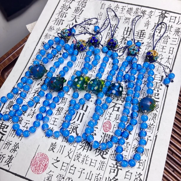 LZ6990-2浅蓝色圆珠蓝黄蛋糕小花琉璃手机链 随机