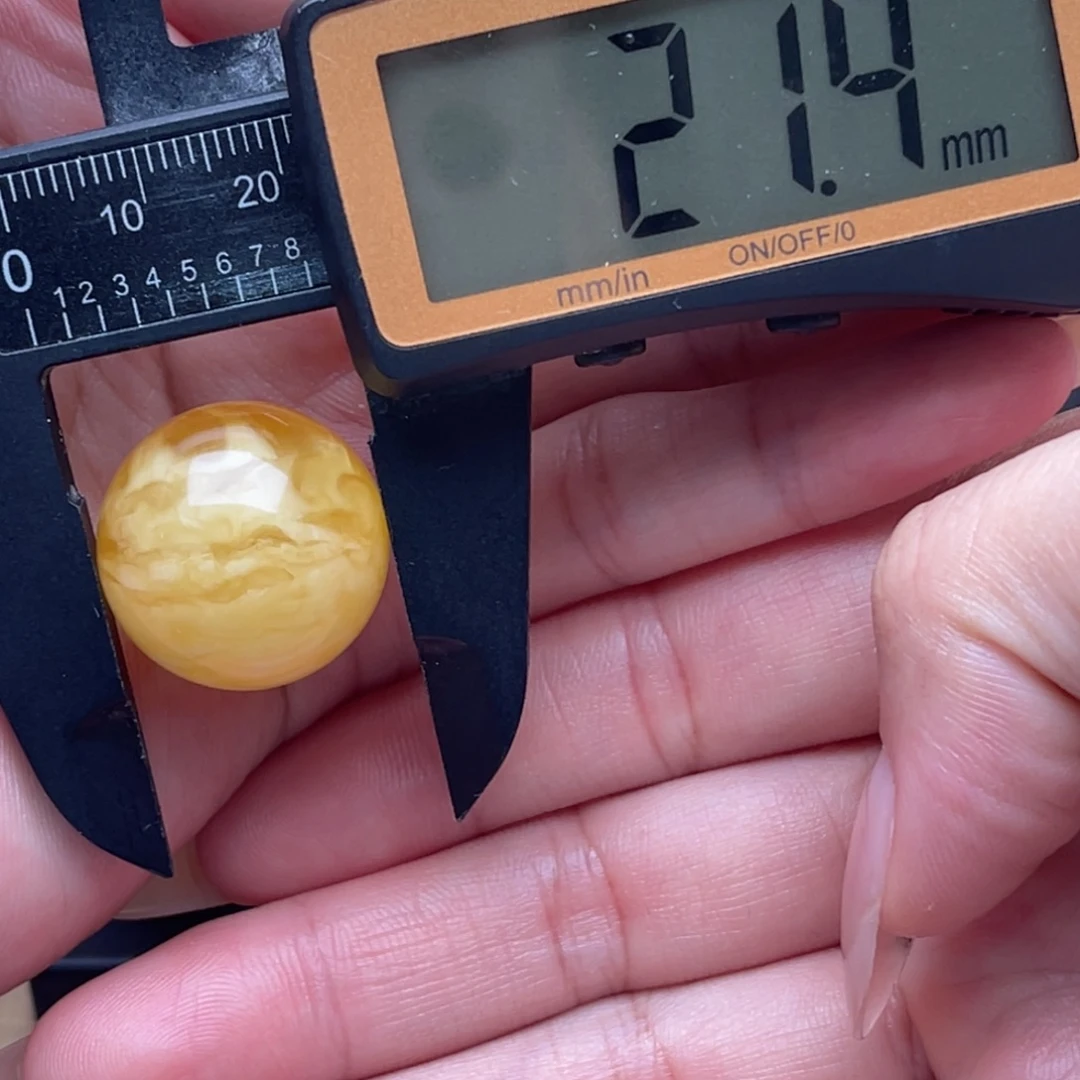 铁***锤琥珀未镶嵌裸石蜜蜡圆珠笑