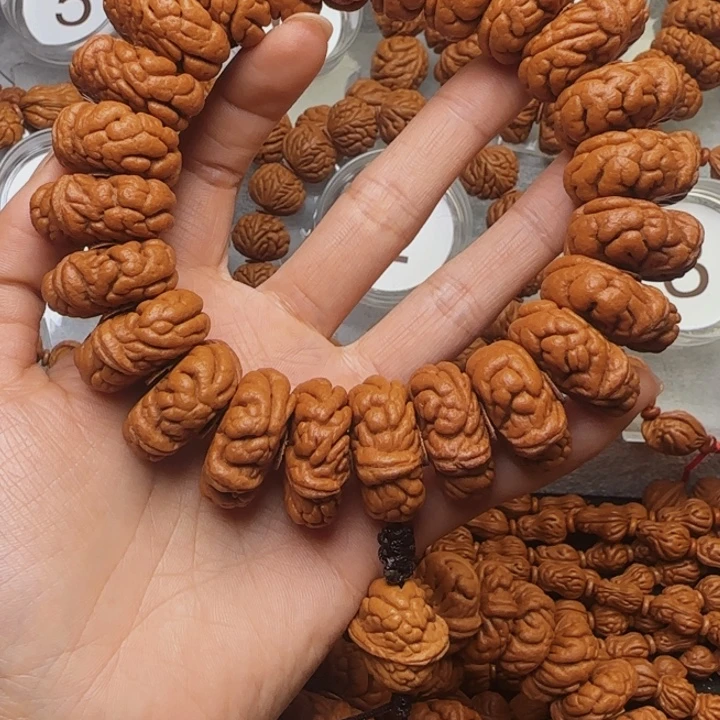 M***i手串桃核霸王龙手持