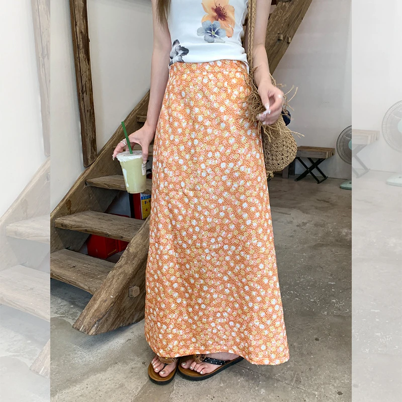 夏季明艳穿搭橘色碎花A字半身长裙女2025新款时尚百搭中长款半裙