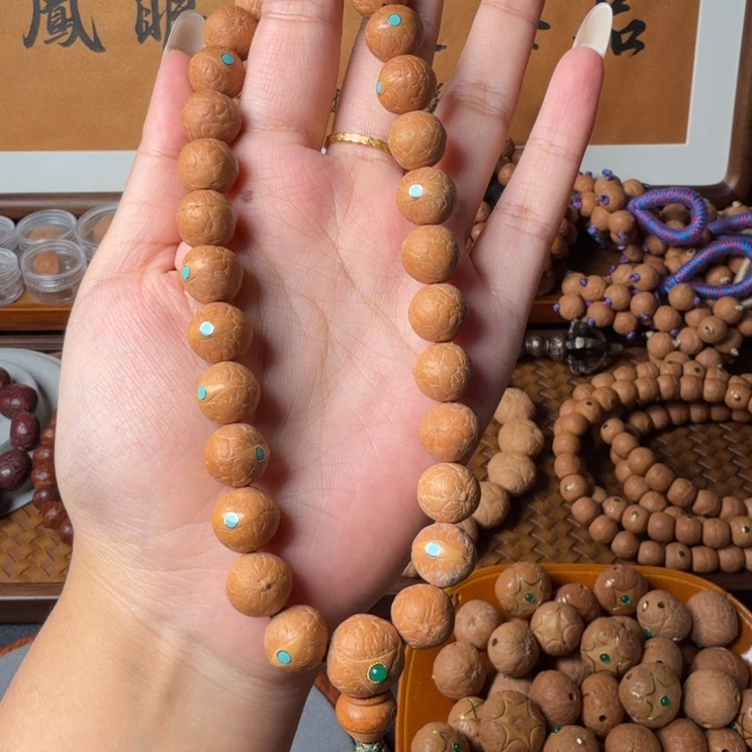 凤眼菩提把件12.5mm/27颗手持/松钉