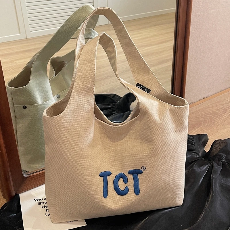 大容量包包女2025新款刺绣字母帆布手提袋小众百搭通勤腋下托特包