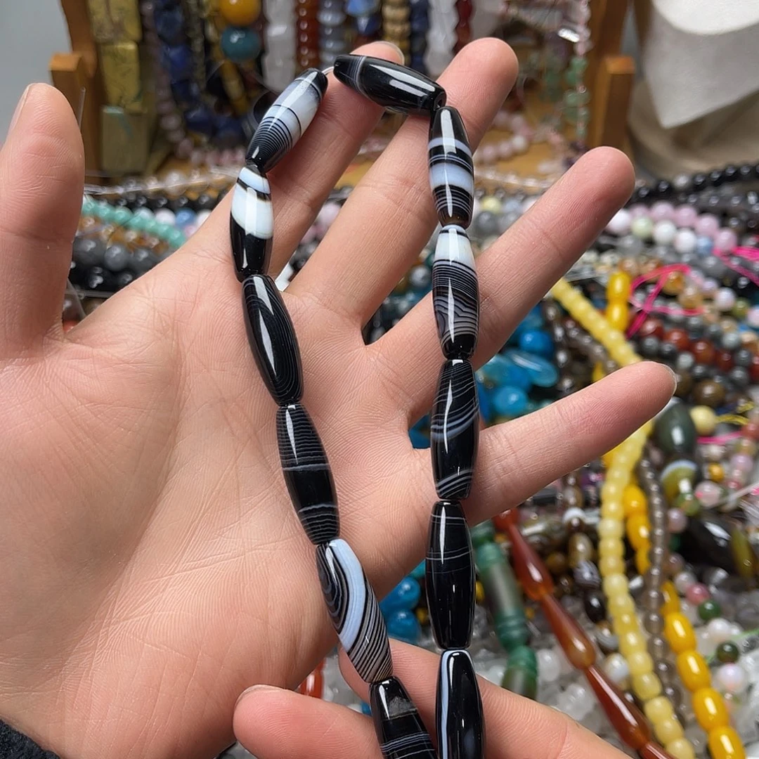 玛瑙/玉髓未镶嵌珠宝半成品10×30黑蚕丝玛瑙天珠一条