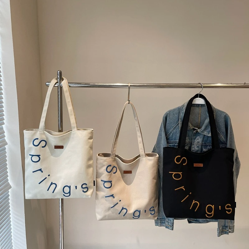 包包女2025新款韩国大容量单肩包学生小众设计感艺术帆布手提包